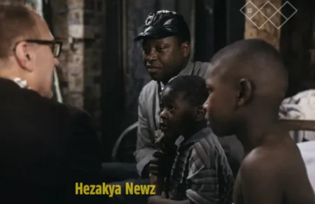 Man with two children, possibly discussing Black hunger in America with another man.