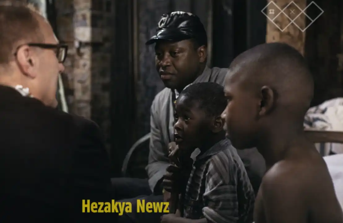 Man with two children, possibly discussing Black hunger in America with another man.