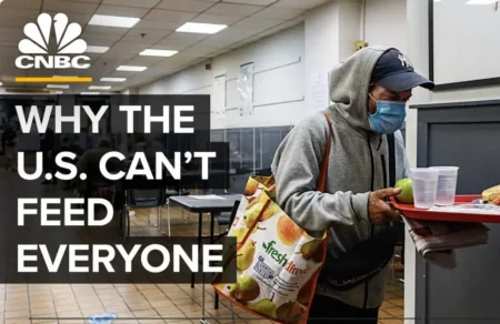 Man with tray at food bank, CNBC logo. Text: "Why the U.S. Can't Feed Everyone.