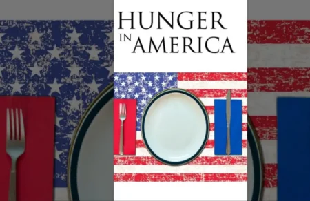 Hunger in America: Empty plate on a distressed American flag tablecloth.