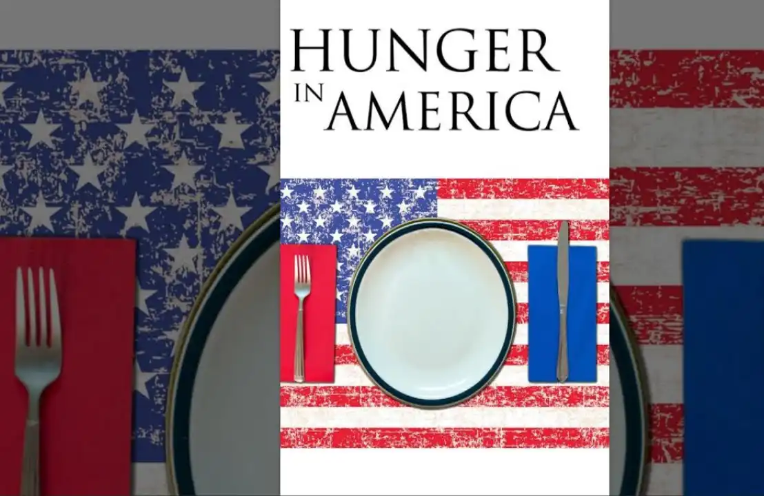 Hunger in America: Empty plate on a distressed American flag tablecloth.