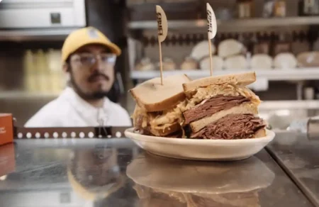 Huge Jewish deli sandwich with pastrami and sauerkraut