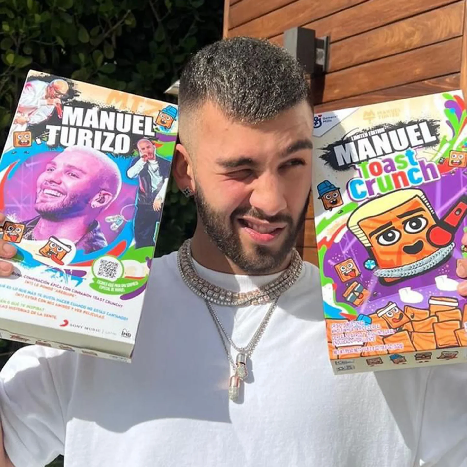 Manuel Turizo holding limited edition "Toast Crunch" cereal boxes with his image.