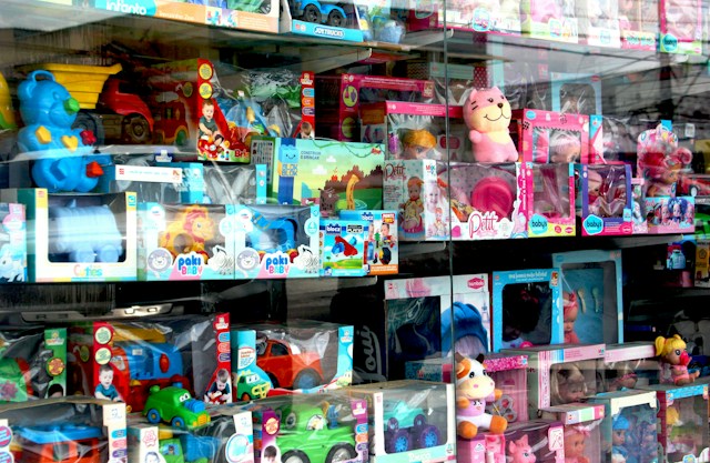 Colorful toy store display featuring various children's toys and games.