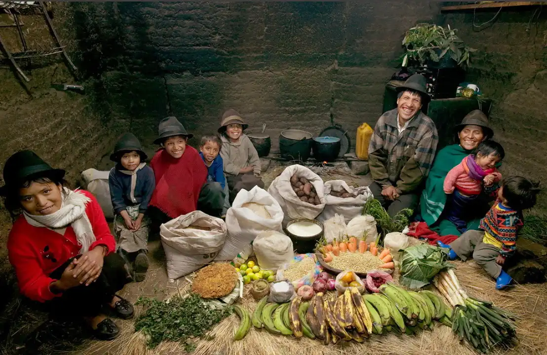 Ecuadorian family with food staples, including potatoes, bananas, and grains.