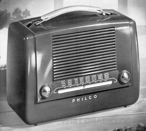 Vintage Philco radio with tuning dial showing frequencies. Philco is visible on the radio.