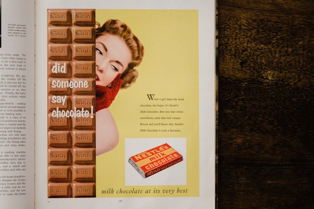 Vintage Nestl&eacute;'s chocolate ad featuring a woman and the text "Did someone say chocolate!