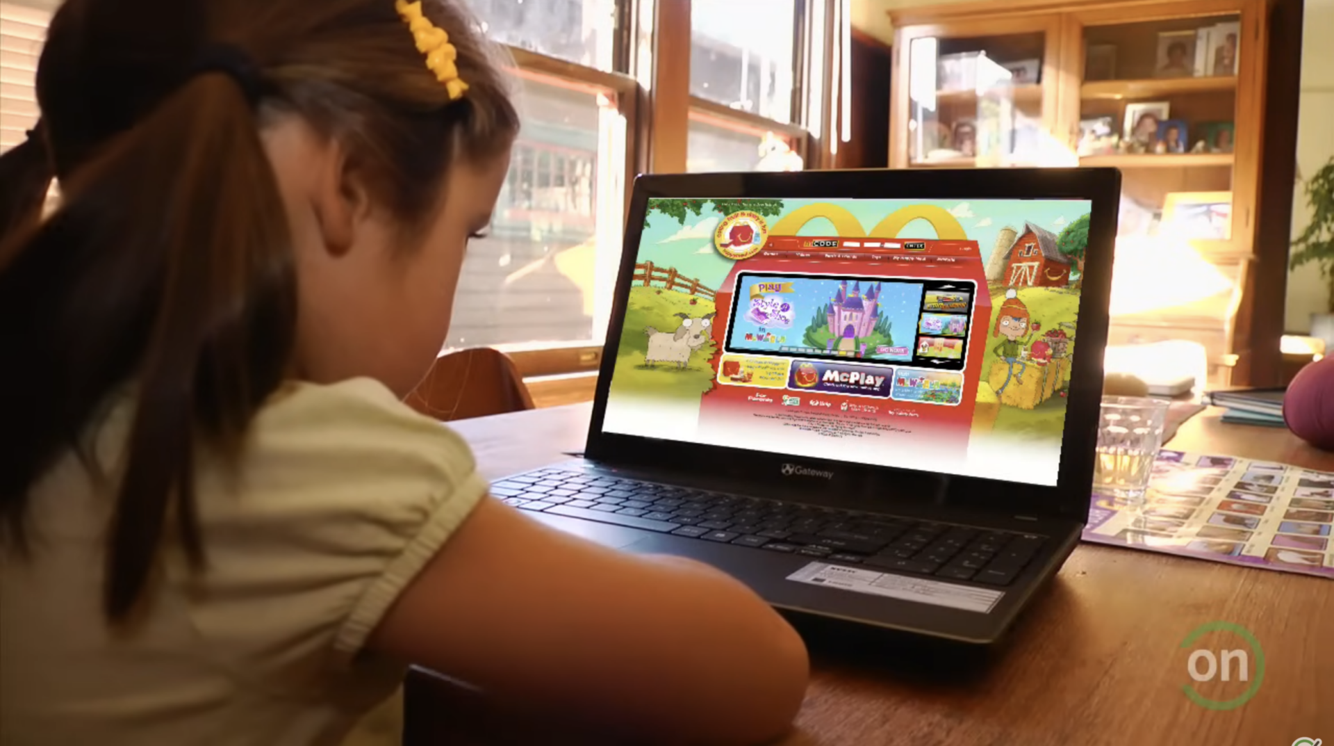 Girl playing McDonald's McPlay game on a Gateway laptop.