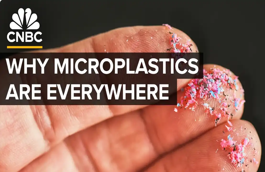 Microplastics on fingers, CNBC logo. Text: "Why Microplastics Are Everywhere