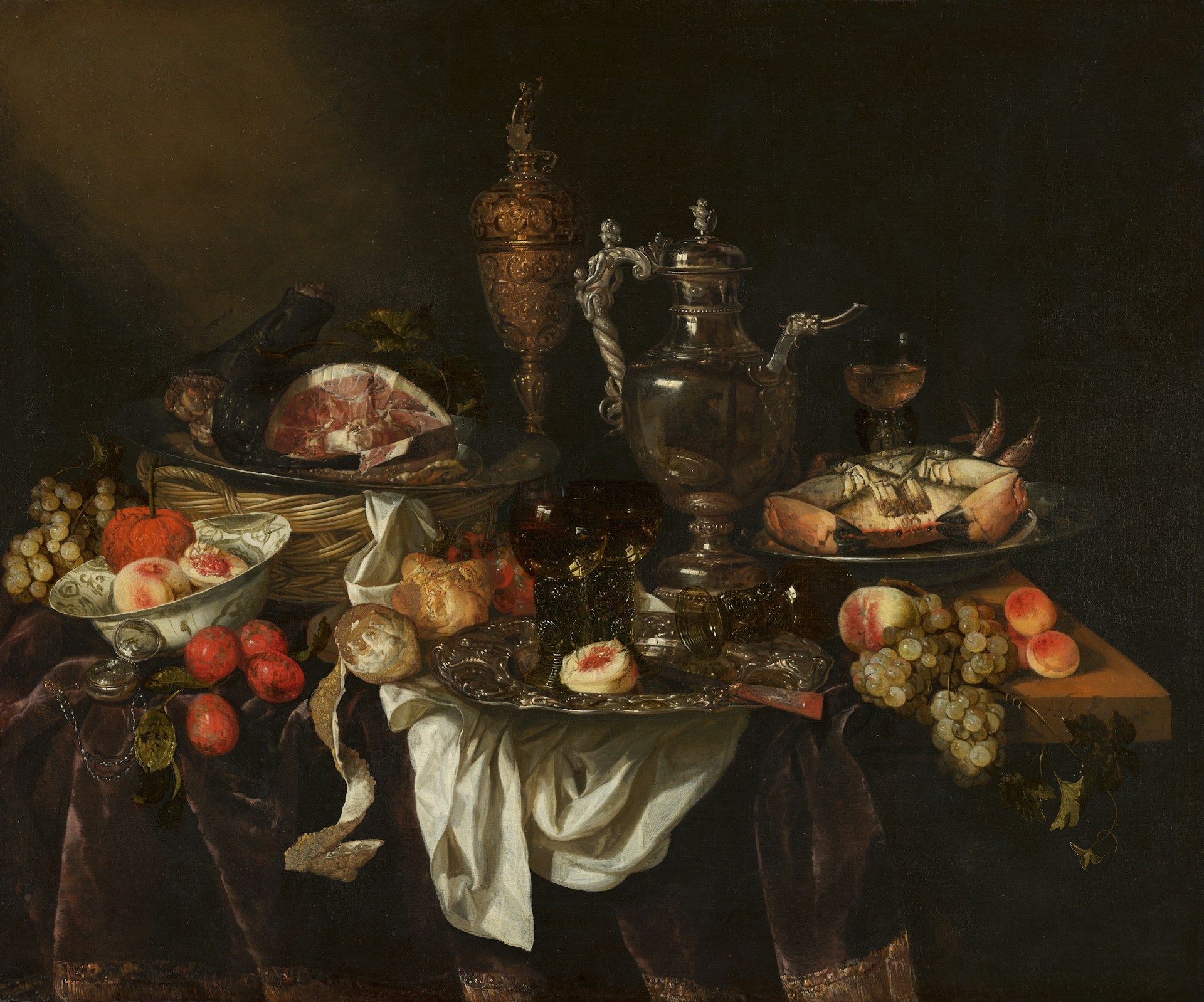 Still life with meat, fruit, and silverware on a dark background