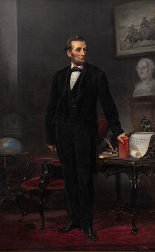 Portrait of Abraham Lincoln in a dark suit standing by a desk with books and a bust.