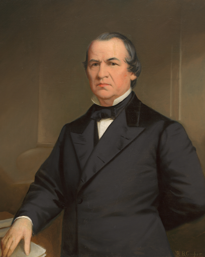 Portrait of Andrew Johnson in a dark suit and bow tie.