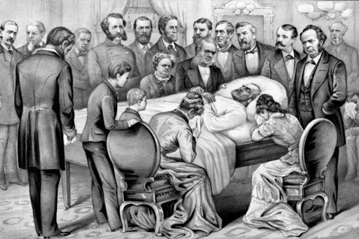 Mourners surround President James A. Garfield's deathbed, including family and dignitaries.