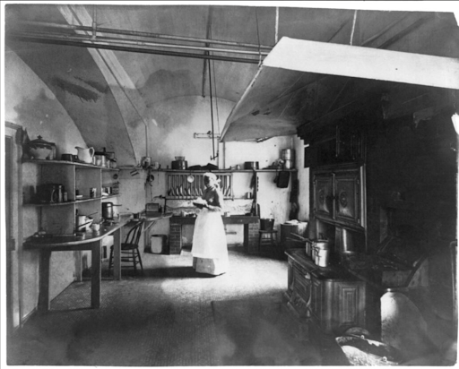Benjamin Harrison's White House kitchen with a woman in an apron.