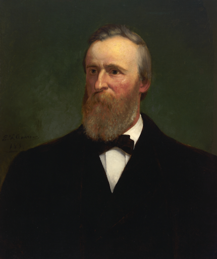 Rutherford B. Hayes portrait: A bearded man in a dark suit and bow tie