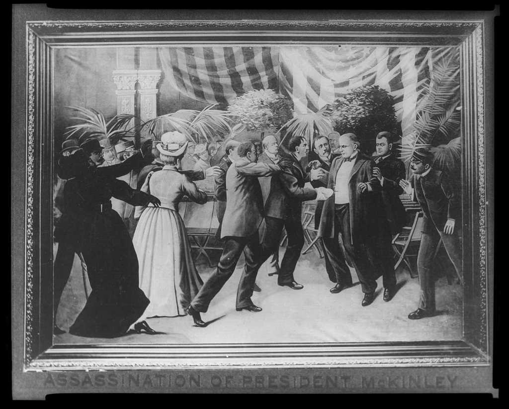Assassination of President McKinley: A chaotic scene with men struggling around the president.