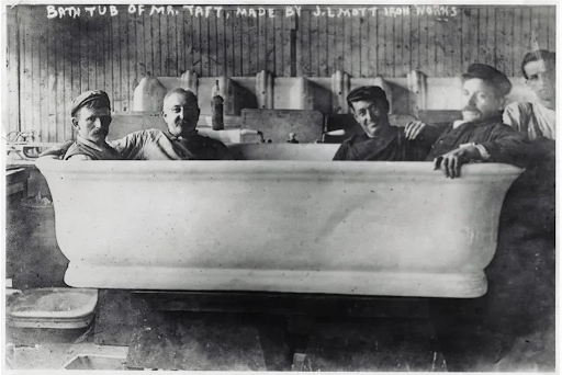 William Howard Taft's large bathtub with five men, made by J.L. Mott Iron Works.